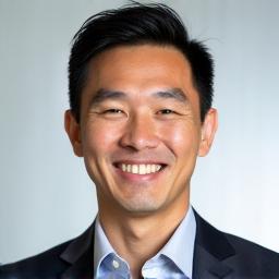 Professional headshot of Marco Chen, a man with a friendly expression.
